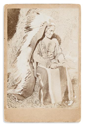 (AMERICAN INDIANS--PHOTOGRAPHY.) Cabinet card of Geronimo as a prisoner of war, holding a pistol in his lap.